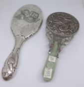 A Chinese pale jade silver on copper hand mirror together with an English hallmark silver and