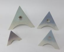 Mary White (1926-2013), four piece pyramid set, in various colours, matt, the tallest 19cm,