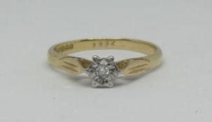 An 18ct illusion set diamond solitaire ring, approx 2.80g.