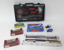 Three battery train sets inc. rail road and also some Models of Yesteryear.