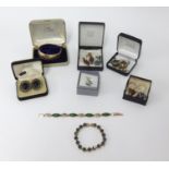 A quantity of various jewellery, napkin rings, brooches, gilt jewellery, wristwatches, bangles etc.