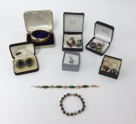 A quantity of various jewellery, napkin rings, brooches, gilt jewellery, wristwatches, bangles etc.