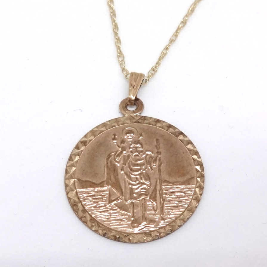 A 9ct gold St Christopher on chain, approx 2.7gms.