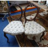 A set of four Victorian balloon back dining chairs, two other Victorian dining chairs and a foot