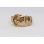 An antique 18ct buckle ring set with diamonds, 2.60g.