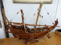 An authentic model of a Dhow built by the Sultanate of Oman's shipbuilders, 1989, length 81cm.