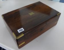 A Victorian rosewood and brass bound writing slope, lacks escutcheon, 36cm wide.