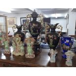 A large Victorian three piece garniture vase set, German bisque three piece garniture set, a pair of