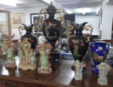 A large Victorian three piece garniture vase set, German bisque three piece garniture set, a pair of