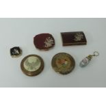 A collection of five various compacts including Melissa and a glass and gilt scent bottle.