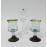 An early 20th century large drinking glass, height 20cm and a pair of other coloured drinking