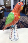 Modern pottery group of a Parrot indistinctly signed, the base marked 'Polly achieves stable