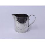 A Georgian silver cream jug marked G? TH with engraved decoration, height 9cms approx 4.23 oz