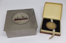 A small cigarette box with plaque of T.S.S.Viceroy of India together with a silver golfing medal