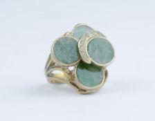 A large green hardstone and yellow gold tiered ring marked 14k, approx 9gms, size N.