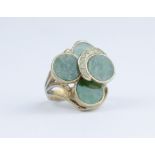 A large green hardstone and yellow gold tiered ring marked 14k, approx 9gms, size N.