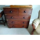 A mahogany two part military chest with brass mounts.