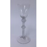 A 19th century wine glass, conical bowl, double knop air twist stem, conical foot, height 18cm.