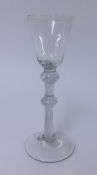 A 19th century wine glass, conical bowl, double knop air twist stem, conical foot, height 18cm.