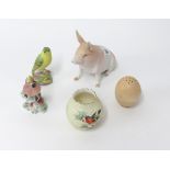 A Worcester porcelain posy pot, bisque porcelain pig, two Worcester bird models No.3200 and 3016 etc