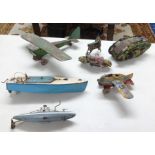 A collection of vintage tinplate toys including aircraft, Japanese clockwork camouflaged