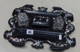 A Victorian paper mache pen and ink stand with mother of pearl inlay, approx 35cm x 25cm.