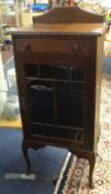 A mahogany side cabinet fitted with a drawer on cabriole legs, width 56cm.