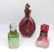 A continental coloured glass scent bottle, Edwardian cranberry glass scent bottle with silver