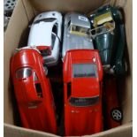 A collection of Burago scale model cars, loose.