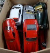 A collection of Burago scale model cars, loose.