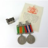 A pair of WWII medals with original box awarded to F.Hill together with a Parker vintage lighter.