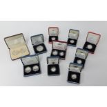 A Royal Mint collection of silver proof £1 and £2 coin sets all cased including 1990 5p two coin