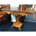A Victorian rosewood fold over pedestal card table.