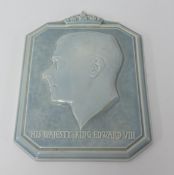 A Poole pottery wall plaque by Harold Brownsword, depicting a relief cast bust of 'His Majesty