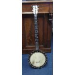 A vintage banjo, cased.