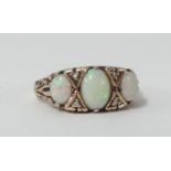 A 9ct opal and diamond ring, size M.