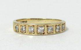 An 18ct diamond set seven stone diamond ring, size L.
