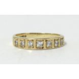 An 18ct diamond set seven stone diamond ring, size L.