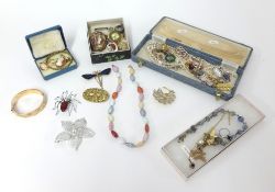 A collection of costume jewellery including brooches, necklaces etc.