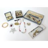 A collection of costume jewellery including brooches, necklaces etc.