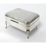 A silver box on four legs, marked 'Chester Assay' 1914, by James Deakin & Sons, total weight 3.
