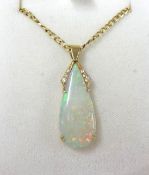 An 18ct opal and diamond pendant on a 9ct chain.