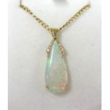 An 18ct opal and diamond pendant on a 9ct chain.