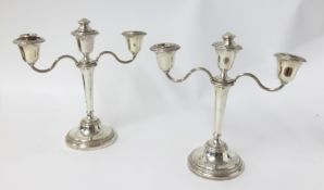 A pair of Geo V twin branch silver candelabras, height 22cm.