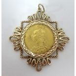 A Queen Victoria 1887 full sovereign, mounted, approx 13.60gms.