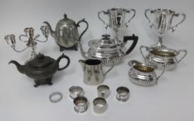 A collection of six silver plated napkin rings, two silver plated cups/chalices by James Dixon &