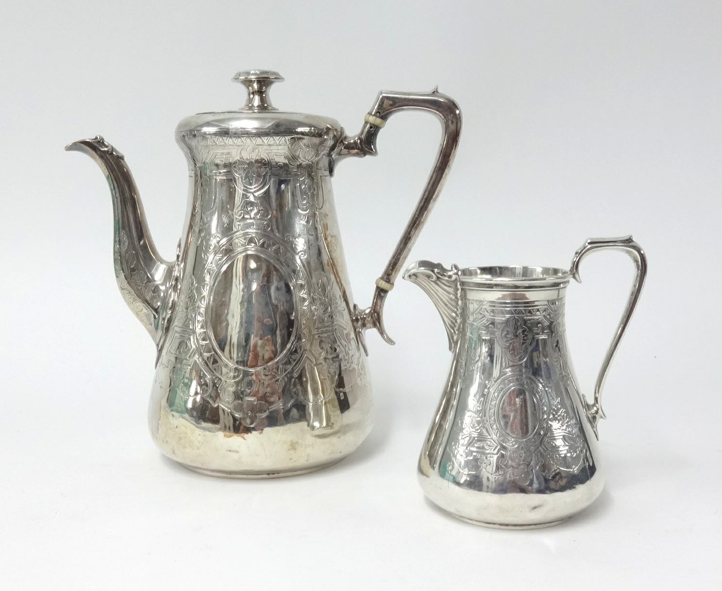 A Victorian silver coffee pot and cream jug, London circa 1863 marked 'CH' for Daniel & Charles