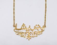 A unmarked high carat yellow gold eastern necklace, approx 9.40gms, marked '21K'.