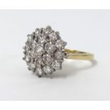 An 18ct cluster ring, size O.