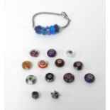 A Troll bead bracelet with 5 blue beads and an additional 13 loose beads, silver mounted with a